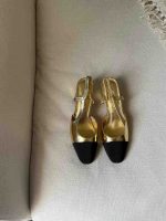 Chanel Gold And Black Laminated Lambskin Leather CC Slingback Pumps