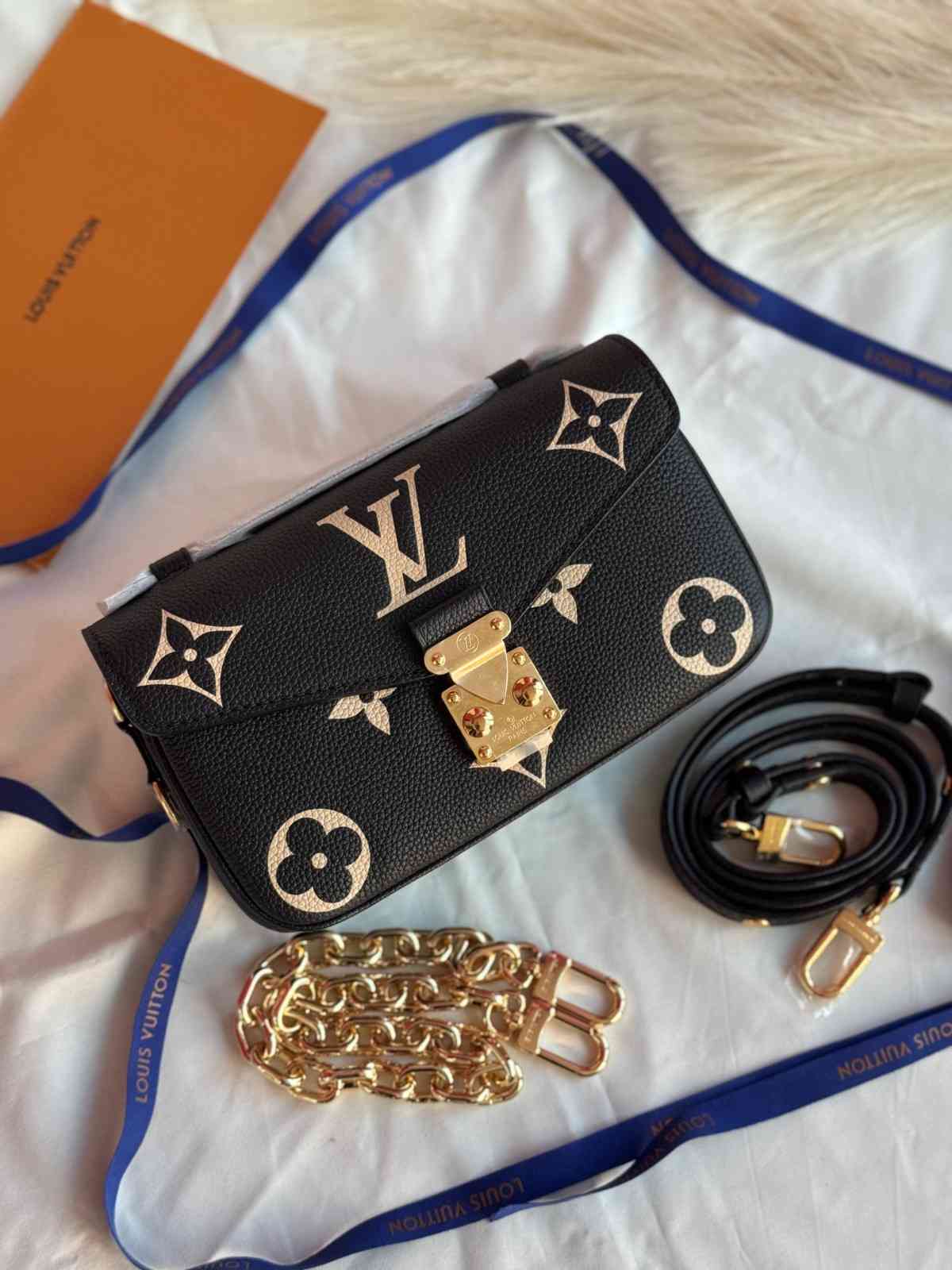 Louis Vuitton Pochette Métis East West Bicolor Monogram Empreinte Leather Bag Louis Vuitton Pochette Metis East West Black/Beige Bicolor Monogram Empreinte Leather Bag - Image 1