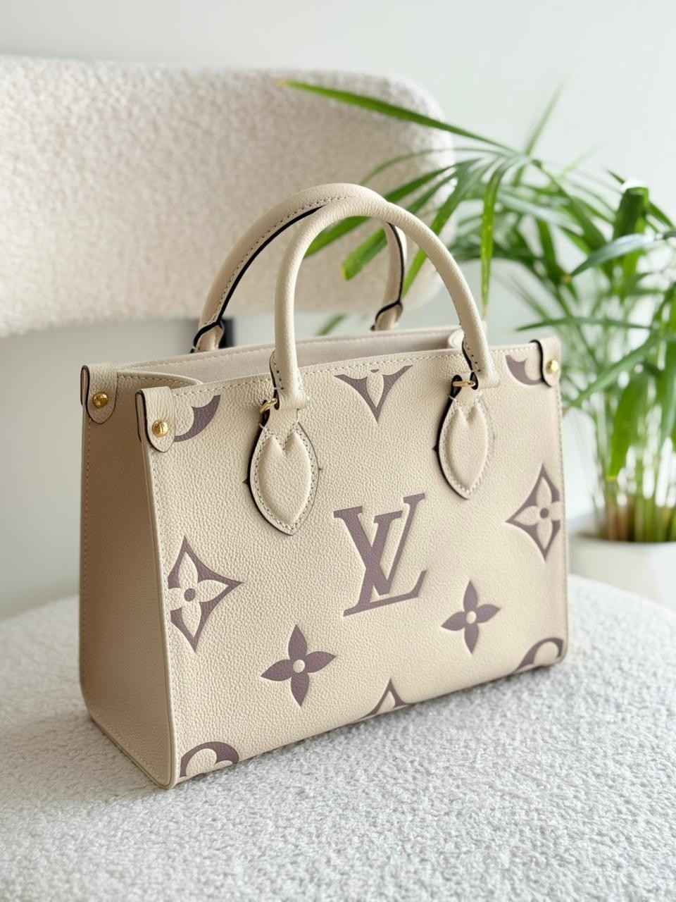 LouisVuittonOnthegoPMCremeBoisDeRoseGiantEmpreinteMonogramCanvasToteBag Louis Vuitton Onthego PM Creme Bois De Rose Giant Empreinte Monogram Canvas Tote Bag - Image 1