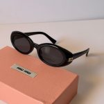 Miu Miu Black MU BO99S Oval Sunglasses With Gold Logo