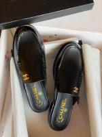 Chanel CC Logo Smooth Calfskin Mules In Black