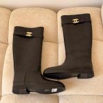 Chanel calfskin cc buckle high boots in black