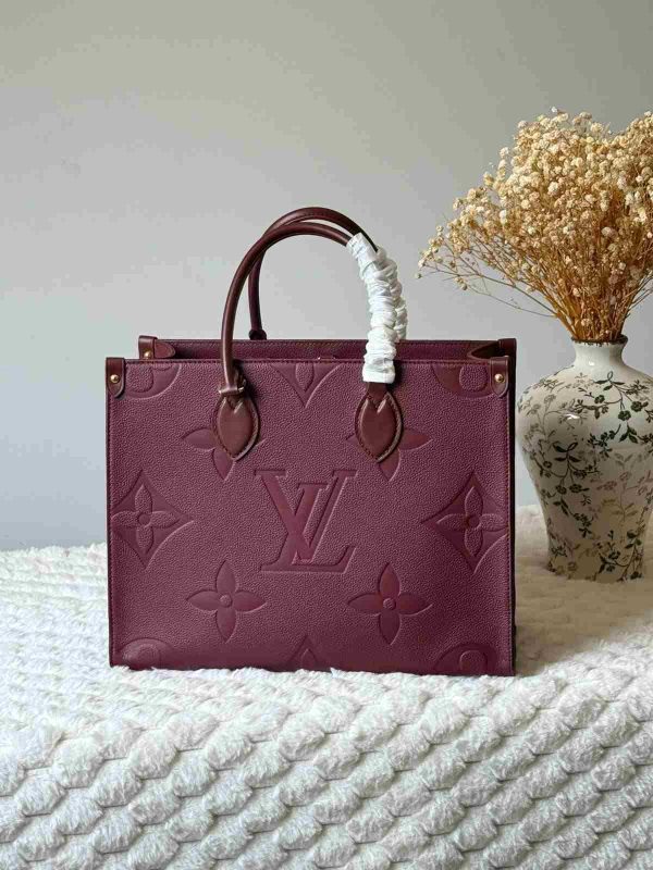 Louis vuitton onthego mm bag in wine