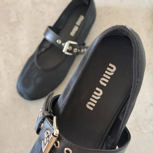Miu Miu black mesh ballet flats.
